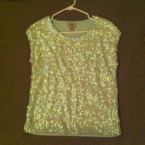 Sequin covers mint colored top. M