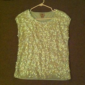 Sequin covers mint colored top. M