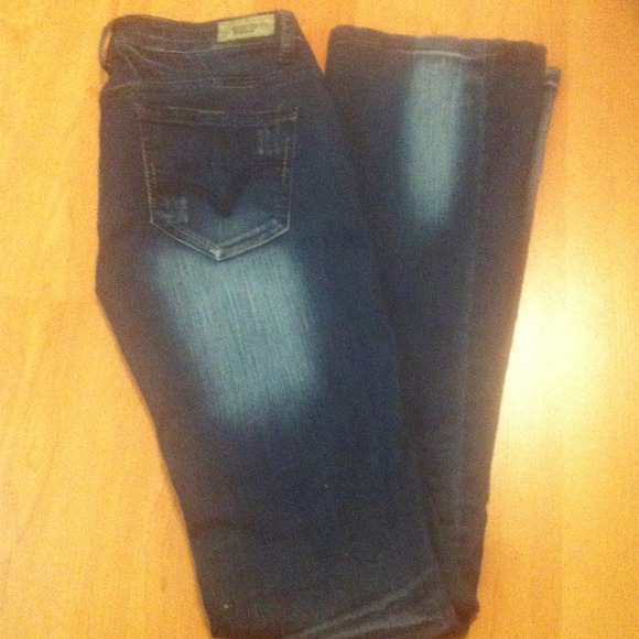 Dark blue jeans with bleach fade