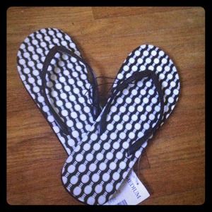 Black and white flip flops