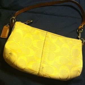 Gold logo coach wristlet