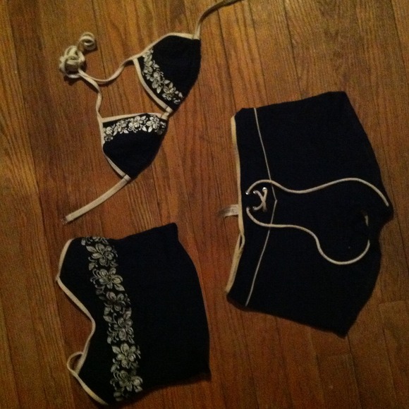 Navy blue bathing suit with 2 alternate tops.