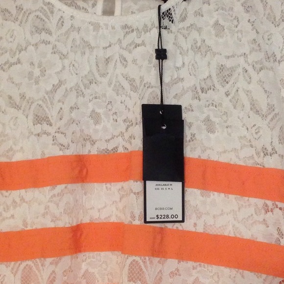 Sweet BCBG ivory lace dress w/tangerine stripes.