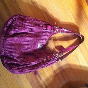 Maroon colored coach bag