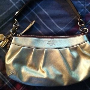 Authentic gold coach bag.