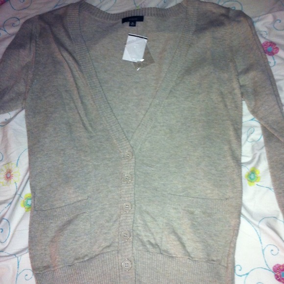 Brand new, never worn 3/4 length sleeve cardigan.