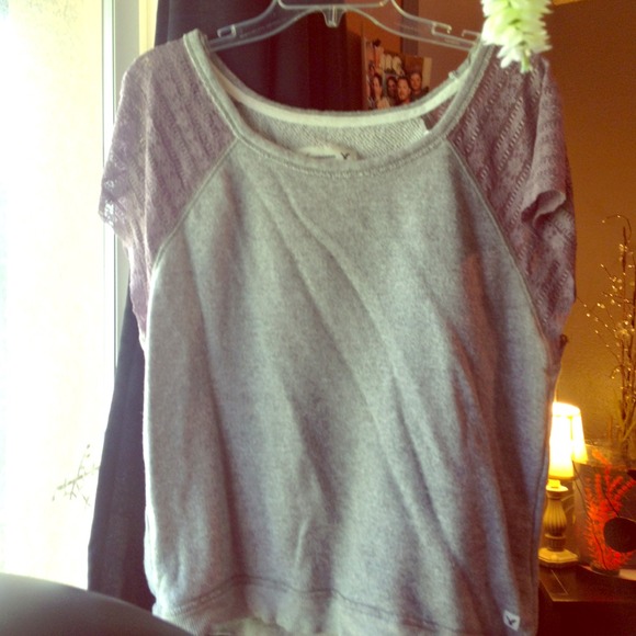 A lace sleeved top with sweater like middle
