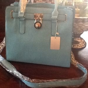 Gorgeous turquoise purse with removable strap. New