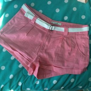 Pink shorts with white belt