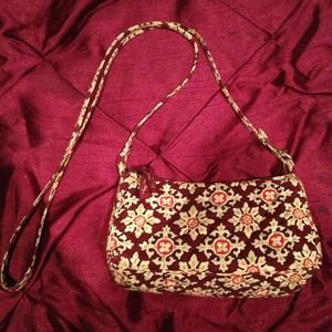 Small maroon Vera Bradley cross body purse
