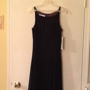 Long dress with floral embellishment on straps.