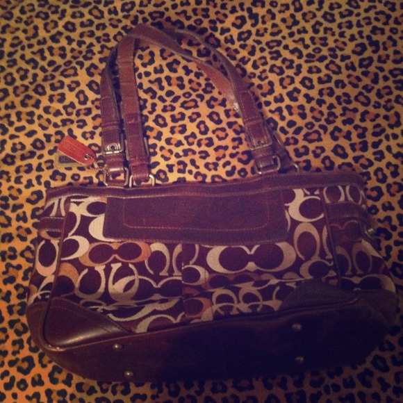 Brown large coach purse .