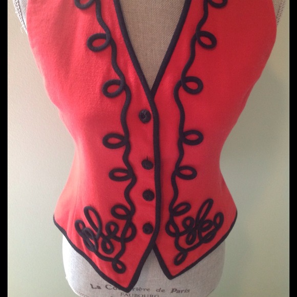 Red wool vest with scroll design.