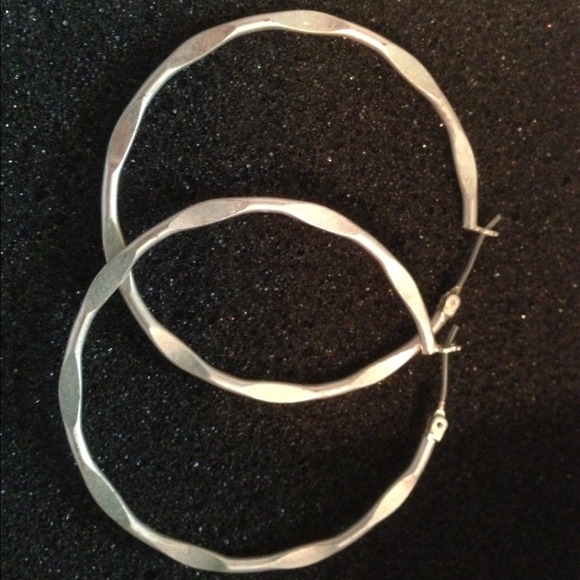 Silver rhodium plated hoop earrings.