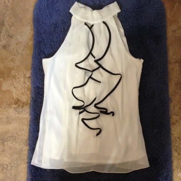 Tops - White shirt with black lined ruffles.