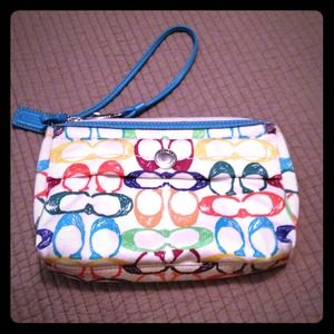 Authentic coach clutch