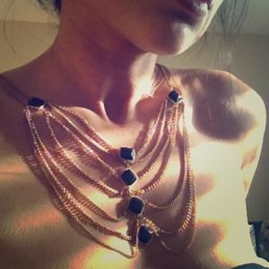 Gold chain and black gem cage necklace