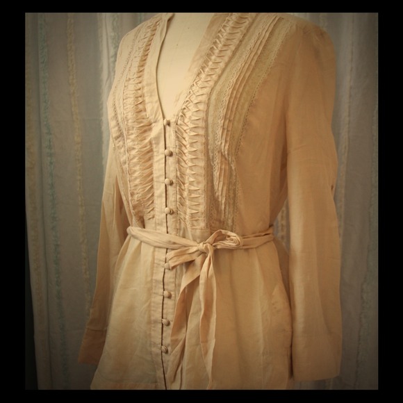 Beige shirt.