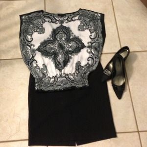 Dress Blouse with tapered waist.