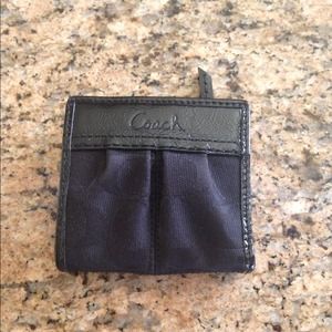 Small black coach wallet.