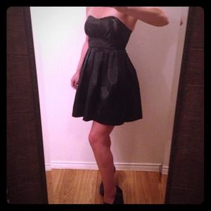 Flirty short Black satin dress.