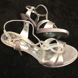 Silver/grey heels with small gemstones attached.