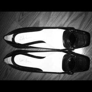 Cole Haan, leather 1 1/2 to 2 inch heel.