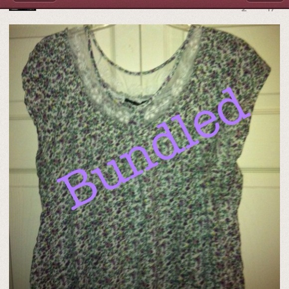 Cute small flower top trimmed in lace.