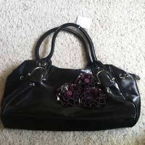 Black purse with purple flowers