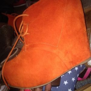 Orange wedge booties