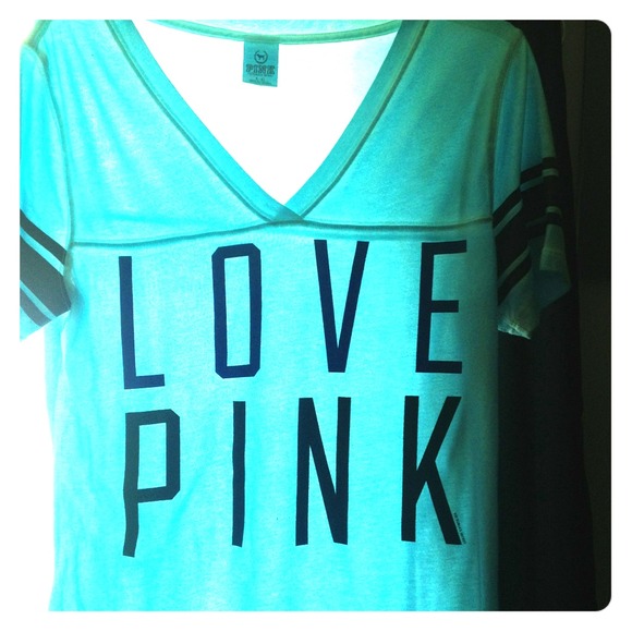 It's a light / teal blue shirt almost from VS