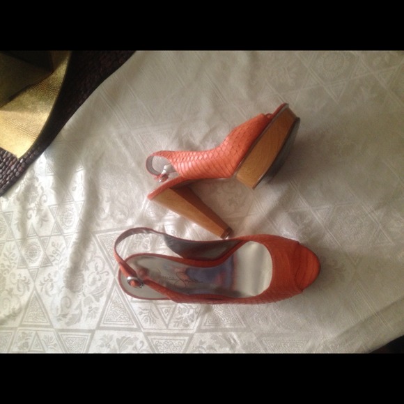 Bright orange plat forms Jessica Simpson size 6