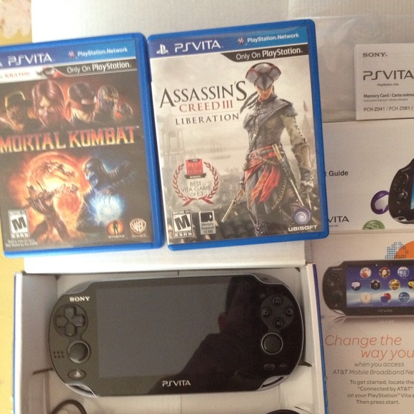SOLD PS VITA WITH CHARGER AND2 games