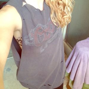 Distressed oversized muscle tee.