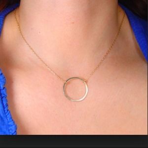 gold necklace with eternity circle pendant