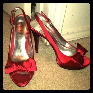 Red peeped toe pumps