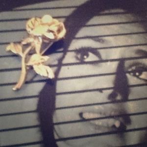 Silver flower pin with a pearl in the middle