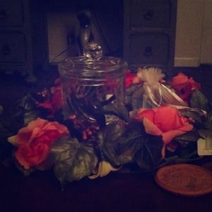 Jar with flowers around it