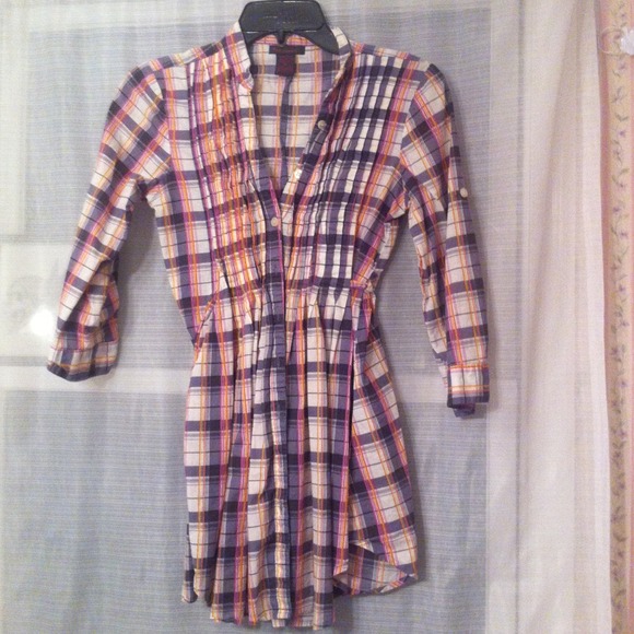 Plaid button down shirt. Flared bottom.