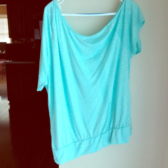 Cute mint colored shirt lost weight too big for me