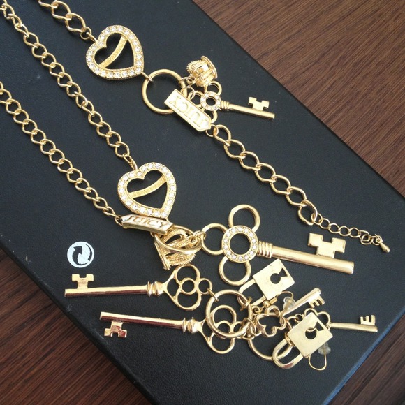 Necklace , bracelet and earrings gold with charms