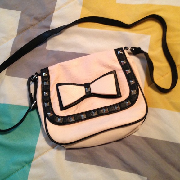 light pink and black bow studs cross body bag.