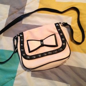 light pink and black bow studs cross body bag.
