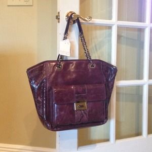 New with tags Badgley Mischka bag. Style Aubergine