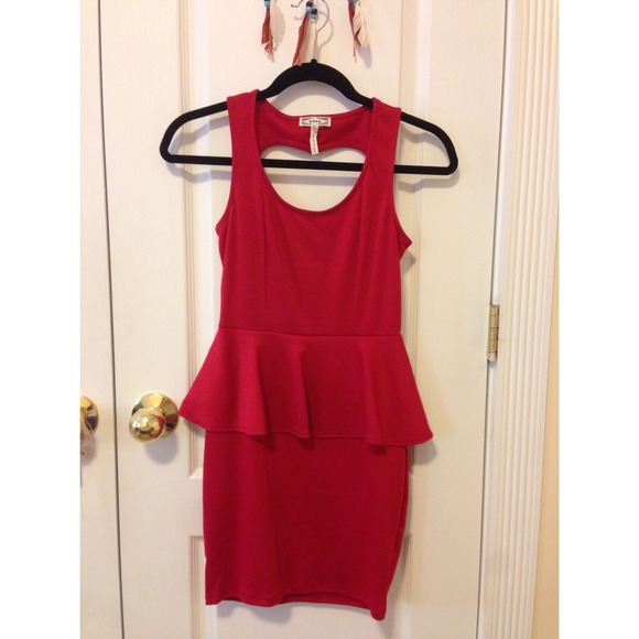 Red peplum dress with heart cutout.