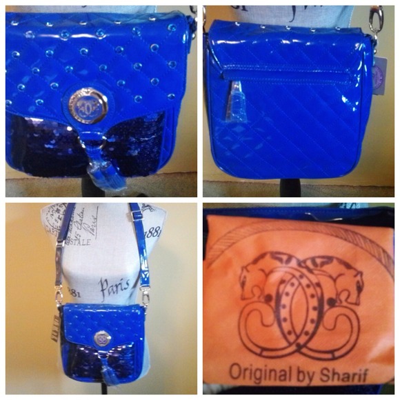 Handbag by Sharif with storage bag.