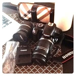 Canon camera EOS Rebel Xsi with two lenses.