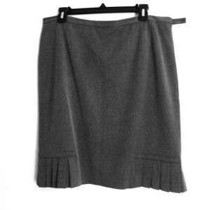 Grey skirt with pleats on bottom.