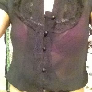 Sheer black top with lace detail