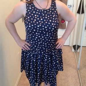 Dress with a shark-bite skirt.